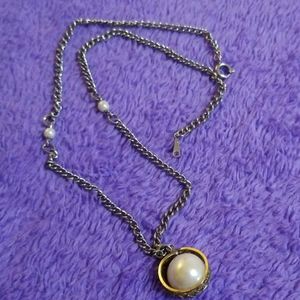 Ring and faux pearl necklace